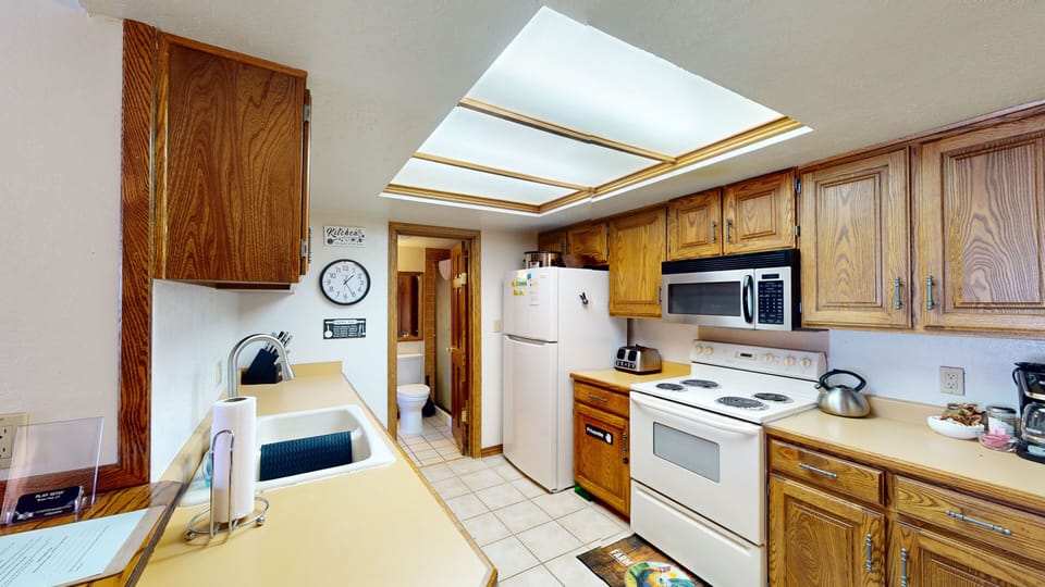 Full Kitchen w/ stove, oven, microwave & dishwasher.