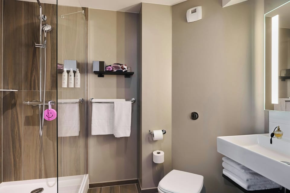 Suite, 1 Queen Bed, Non Smoking | Bathroom | Shower, hair dryer, towels, soap