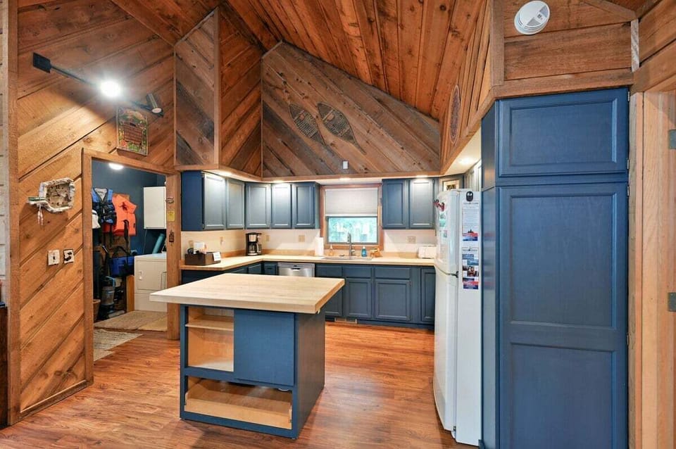 Off the kitchen is a convenient  laundry and storage area.
