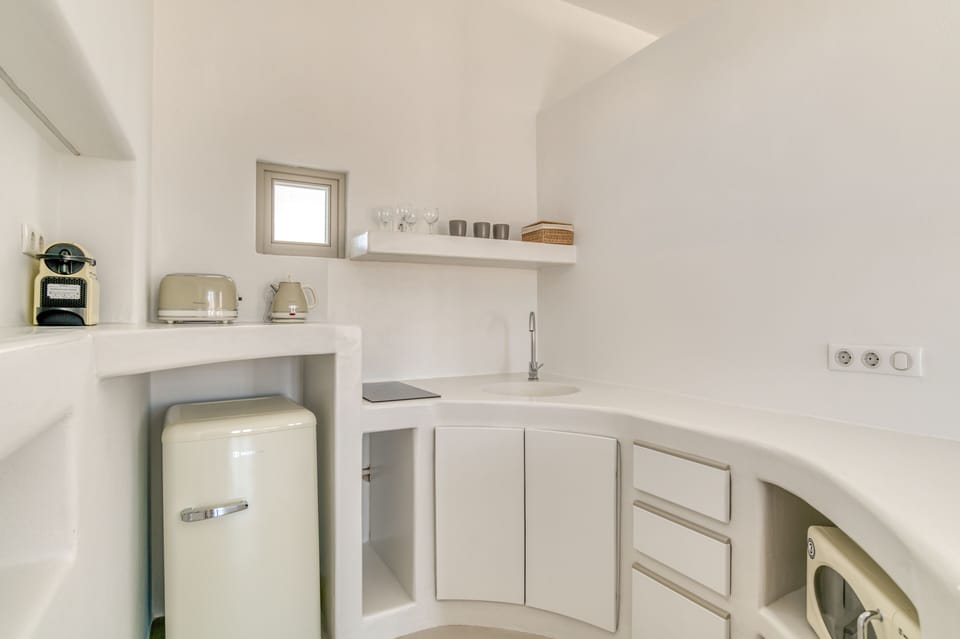 Superior Suite | Private kitchen | Espresso maker, coffee/tea maker, dining tables