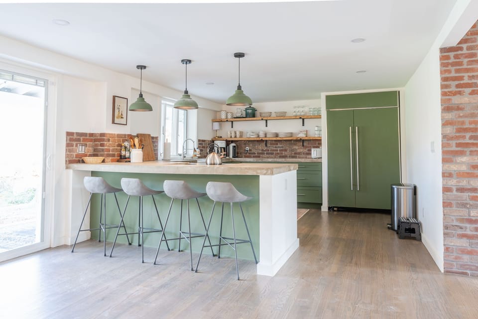 Eat-in kitchen with brick accents
