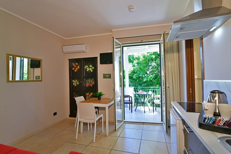 Classic Apartment, Garden View | In-room safe, iron/ironing board, free WiFi
