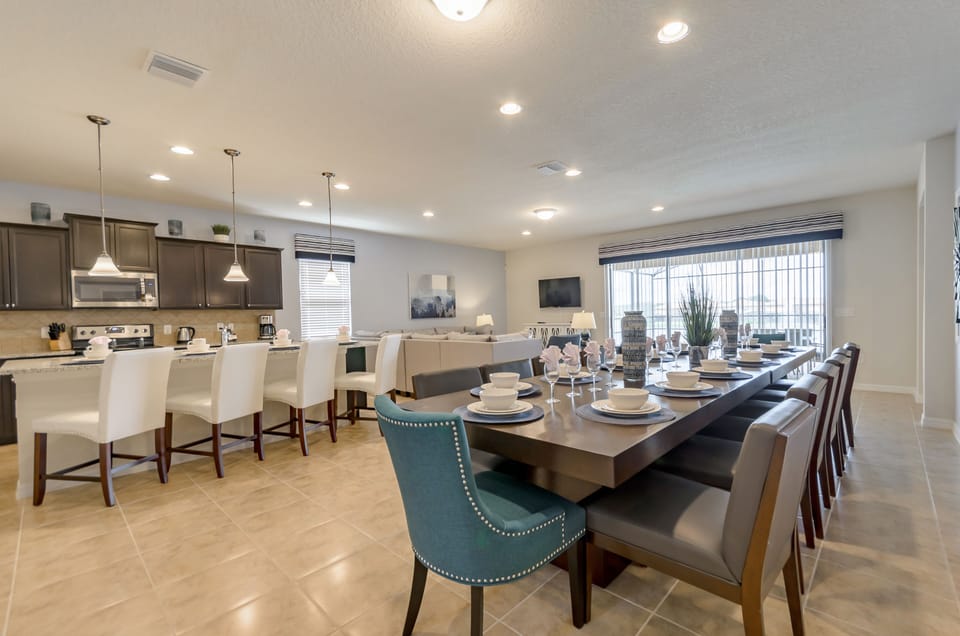 Spacious Downstairs Area Including Full Size Kitchen, Dining Table, and Comfortable Seating