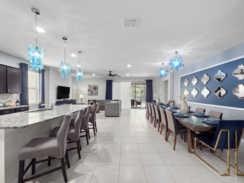 Spacious Downstairs Area with Full Size Kitchen, Dining Table, and Comfortable Lounge with Flat Screen TV