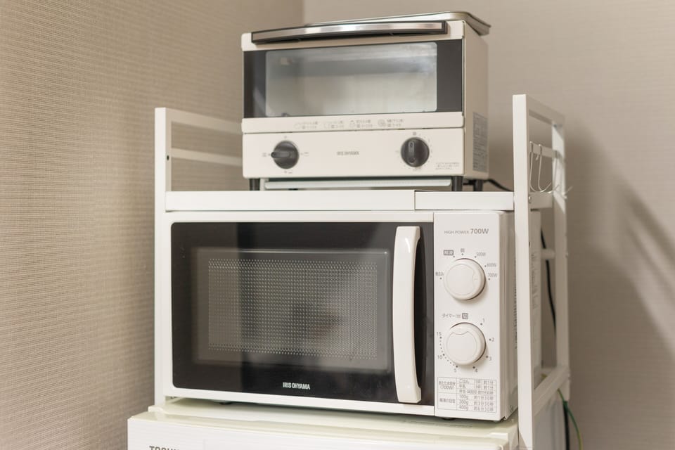 Cook quick meals or heat up takeout with easy-to-use appliances provided