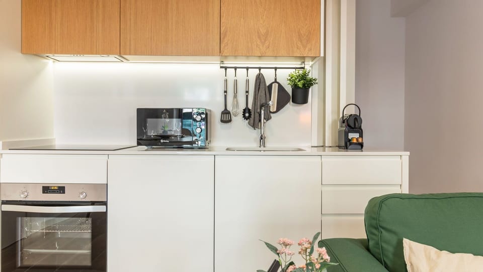 Modern kitchenette, equipped with all the utilities and essentials you might need during your stay, like a microwave, stove, oven and more! #practical #nice