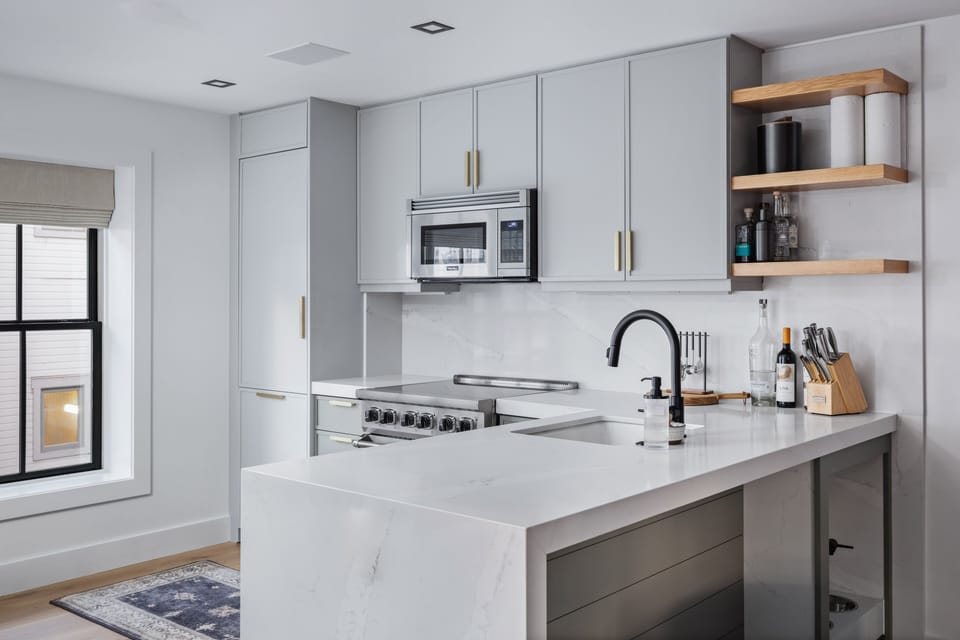 New kitchen with waterfall granite tops