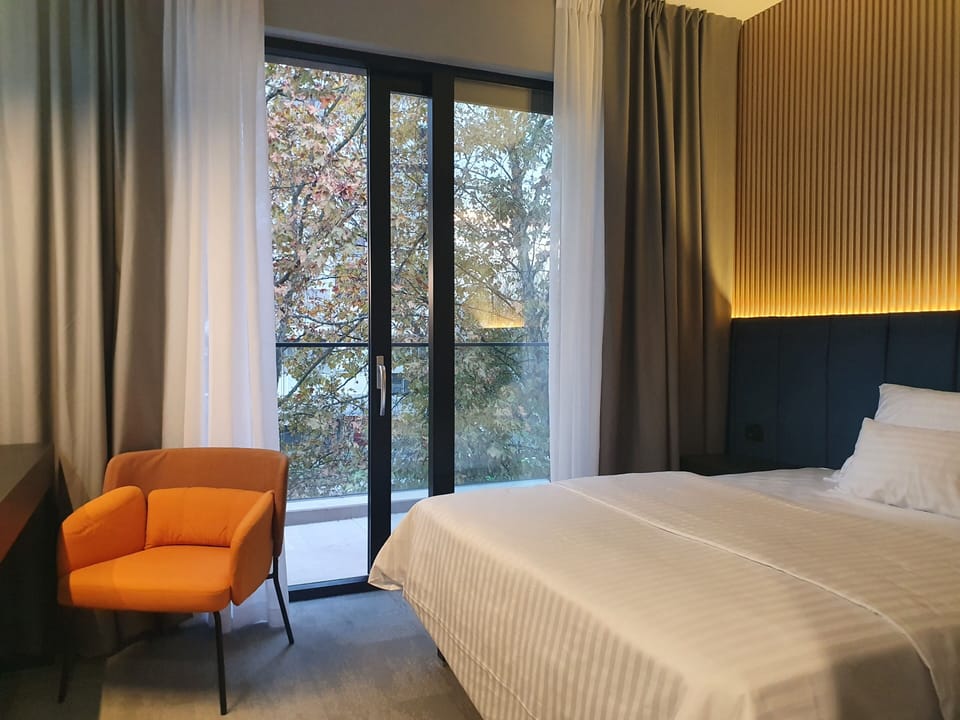 Premium bedding, down comforters, memory foam beds, free minibar