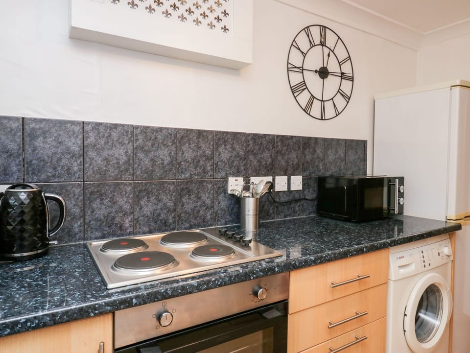 Fridge, electric kettle, toaster, cookware/dishes/utensils