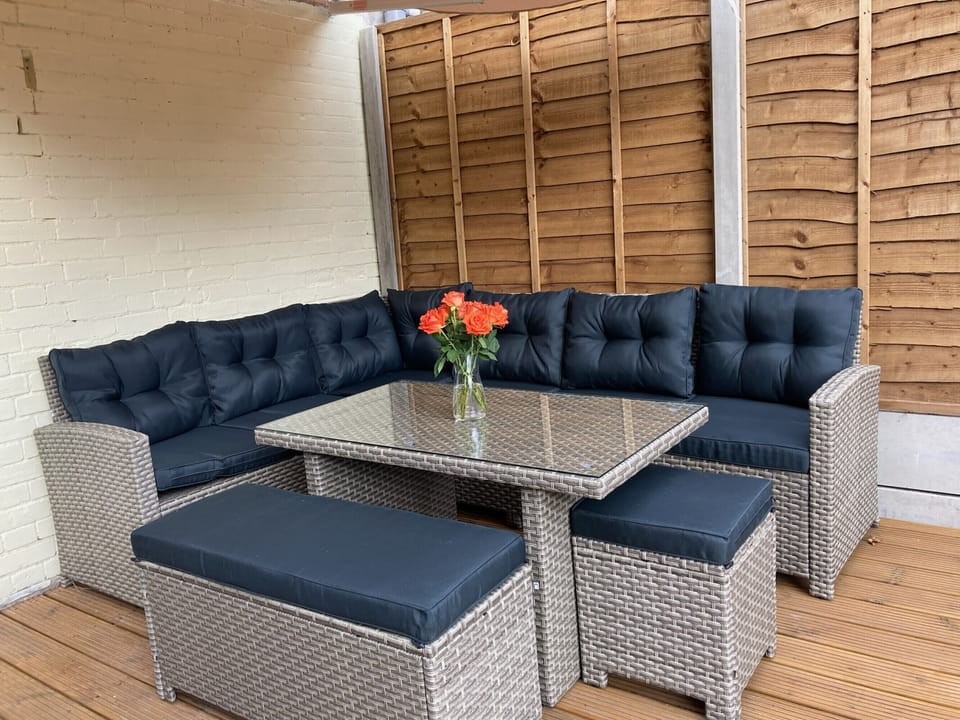 Decking area with sofa and table