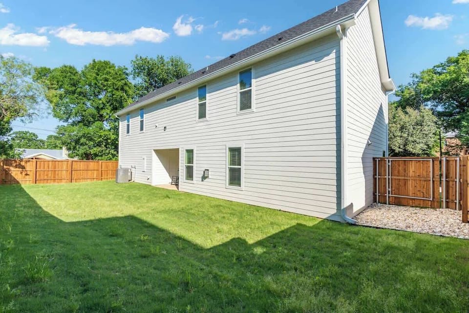 The backyard is enclosed with a fence.