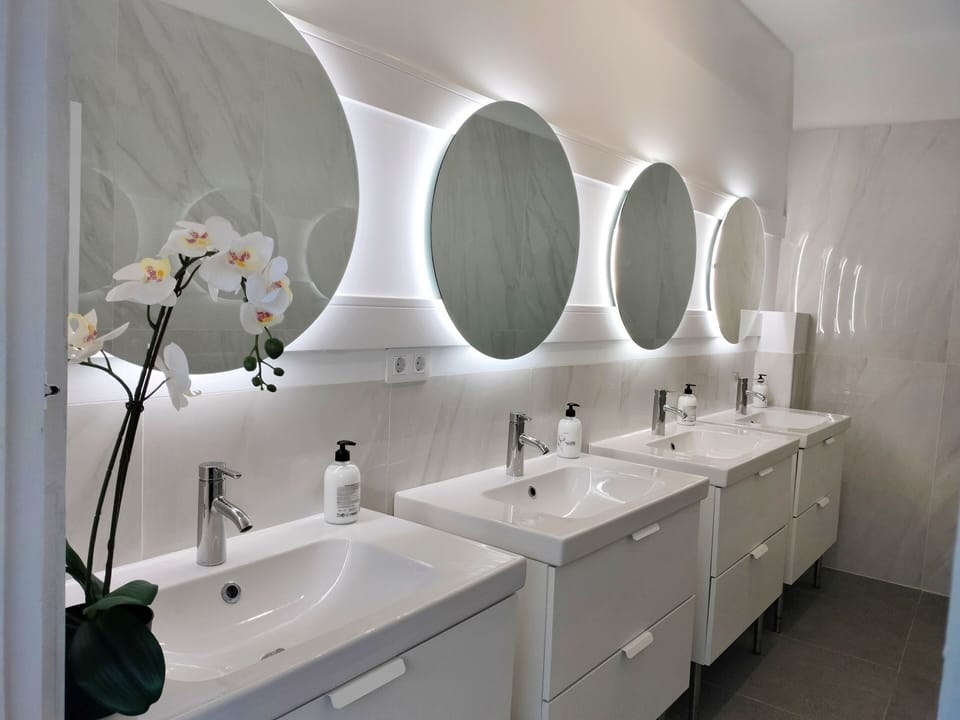 Shower, rainfall showerhead, hair dryer (on request), towels