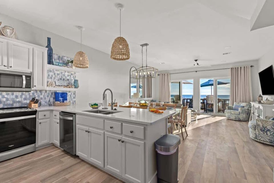 Kitchen opening to living space and beach view (1st floor)