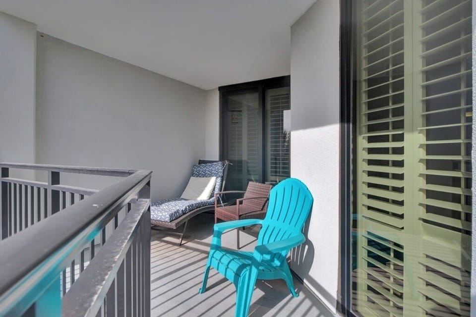 - Stretch out on the cushioned lounger or unwind in the bold turquoise chair - Enjoy a cool retreat on the covered balcony, perfect for breezy afternoons - Great for flipping through a book or catching up over evening conversations