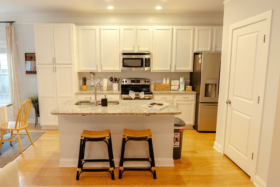 Kitchen fully stocked with appliances and cooking utensils