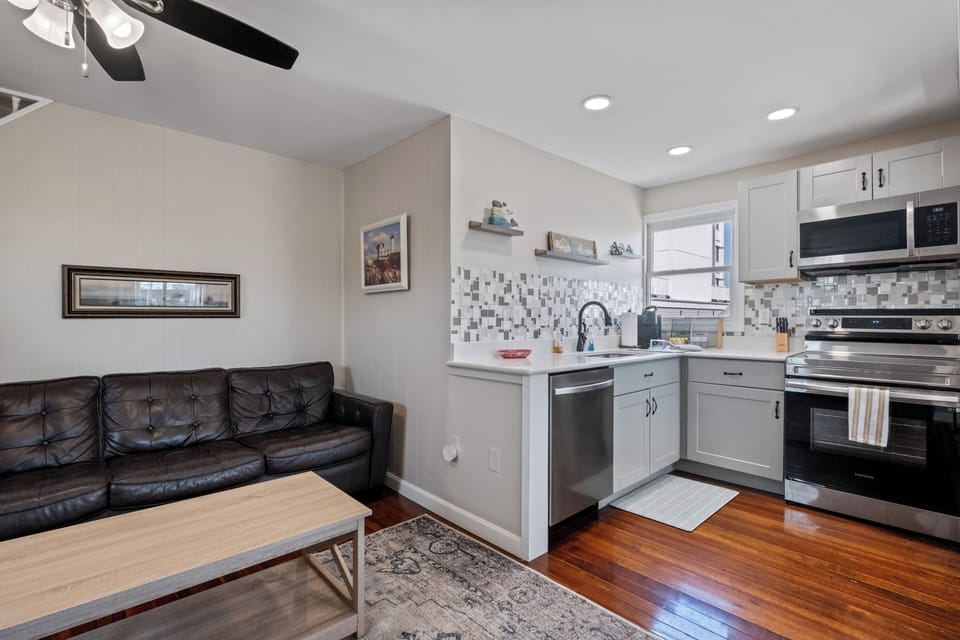 Kitchen has modern appliances including a dishwasher and Kuerig coffee maker.