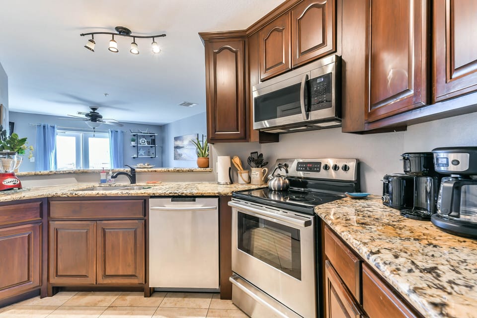 KITCHEN IS FULLY EQUIPPED WITH FULL SIZE APPLIANCES INCLUDING A DISHWASHER