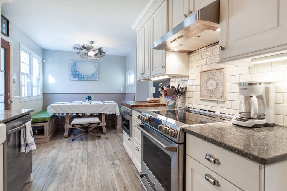 There are both large and small appliances in the kitchen.  Starter coffee grounds and sweeteners for the coffeemaker are ready for check-in.