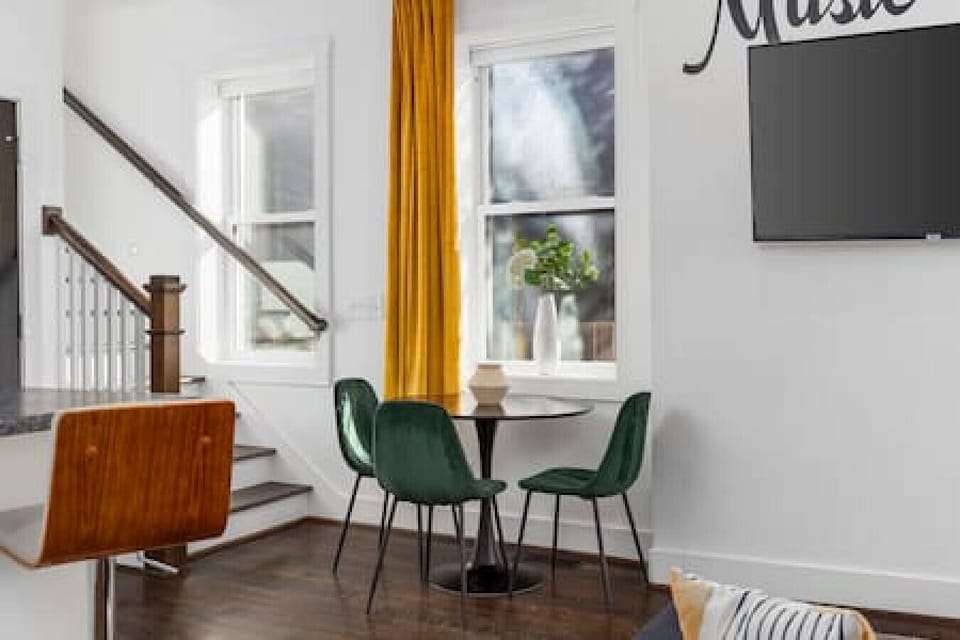 Share a meal at the dining table with seating for 3.