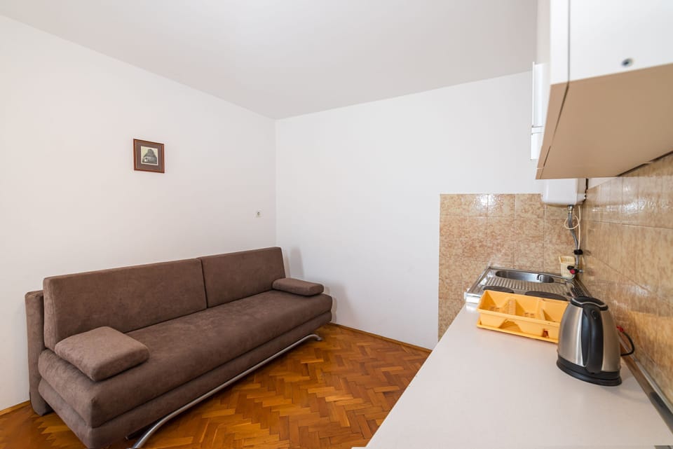Apartment, 1 Bedroom, Balcony, Garden View | Living area | Flat-screen TV