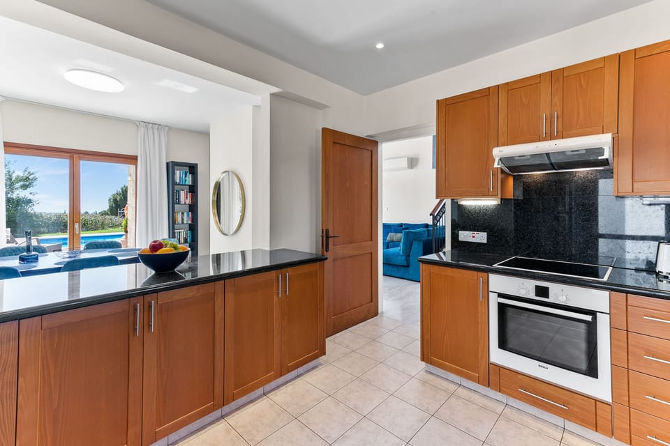 Villa | Private kitchen | Coffee/tea maker, full-size fridge, microwave, oven