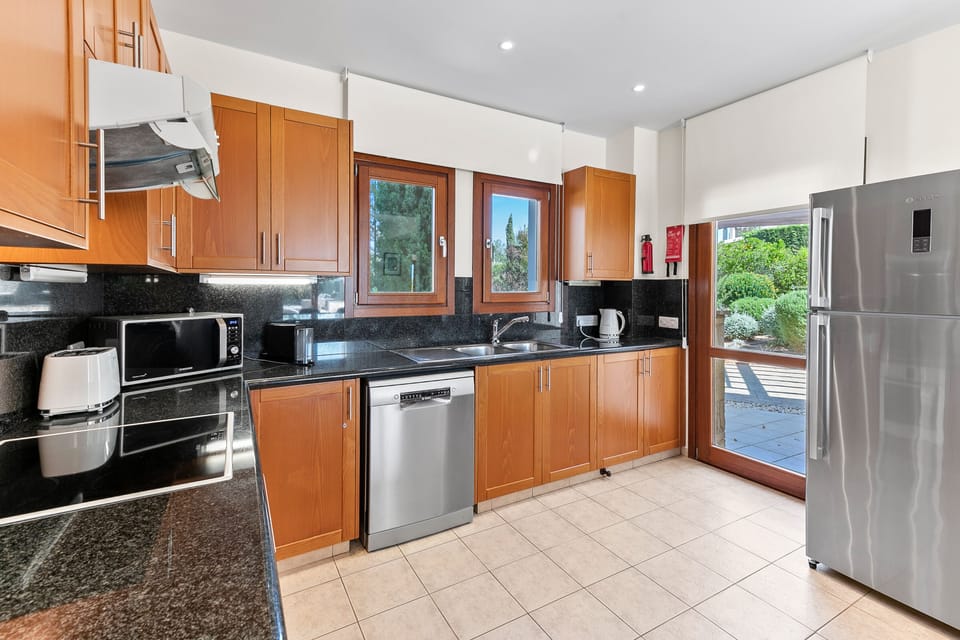 Villa | Private kitchen | Coffee/tea maker, full-size fridge, microwave, oven