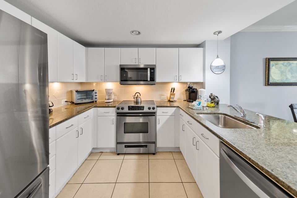 Your fully equipped kitchen features granite countertops, stainless steel appliances, and everything you need to create memorable meals during your stay.