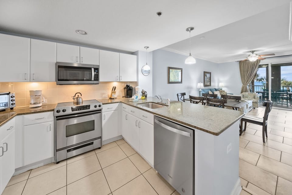 Your spacious kitchen boasts granite countertops, stainless steel appliances, and flows seamlessly into the dining area for memorable meal preparations.