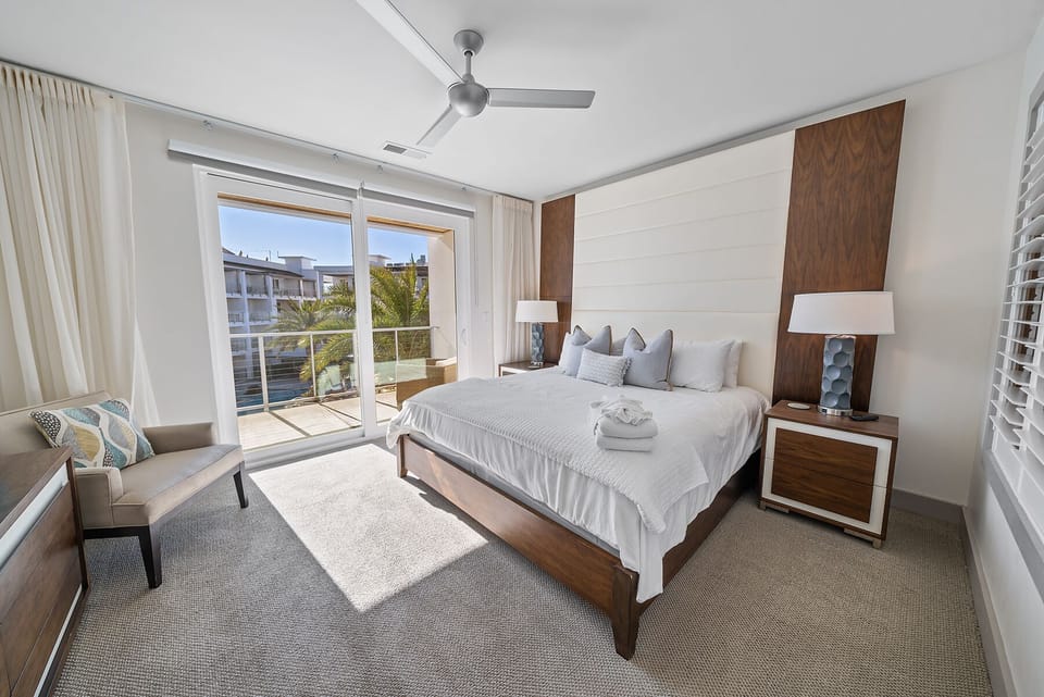 Rest peacefully in your modern bedroom with crisp linens, contemporary walnut furnishings, and French doors opening to your private balcony.
