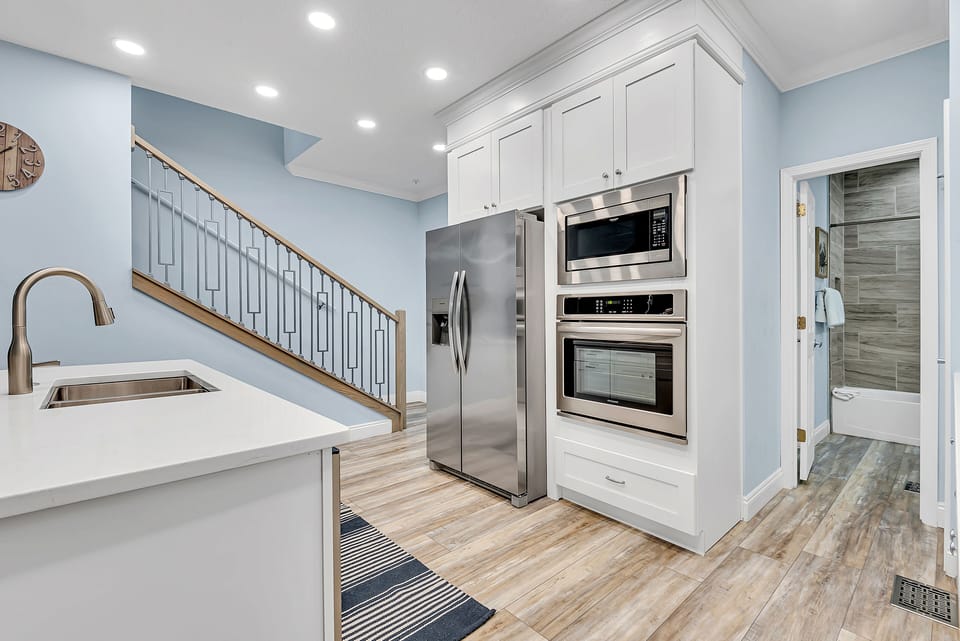 2nd Floor - 🍽️ Fully Equipped Kitchen – Stainless steel appliances, breakfast bar, and open layout