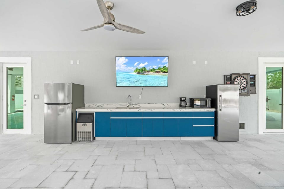 Stay in touch with the living room crowd by relaxing at the bar.