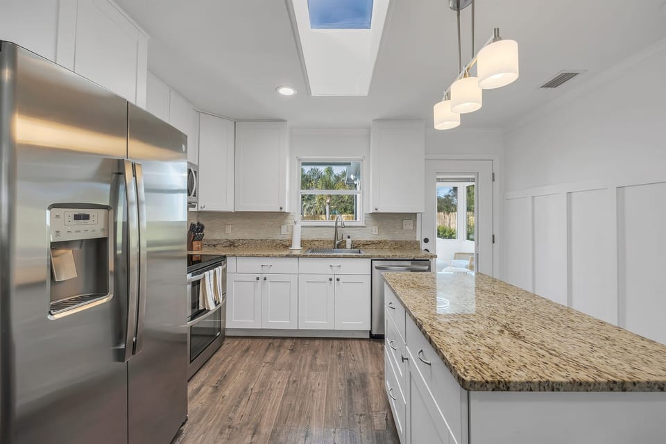 Spacious kitchen with stainless appliances and ample counter space