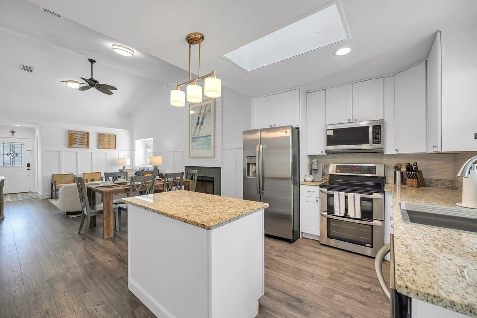 Open-concept fully stocked kitchen