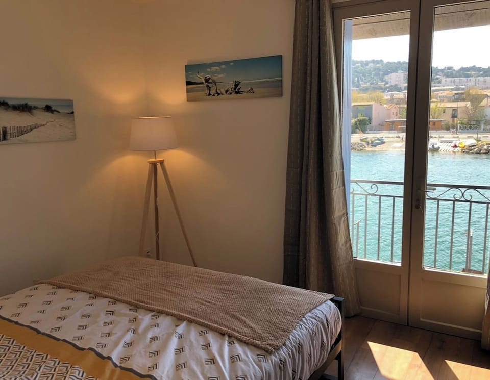 Bedroom on the second floor overlooking the quay and canal.