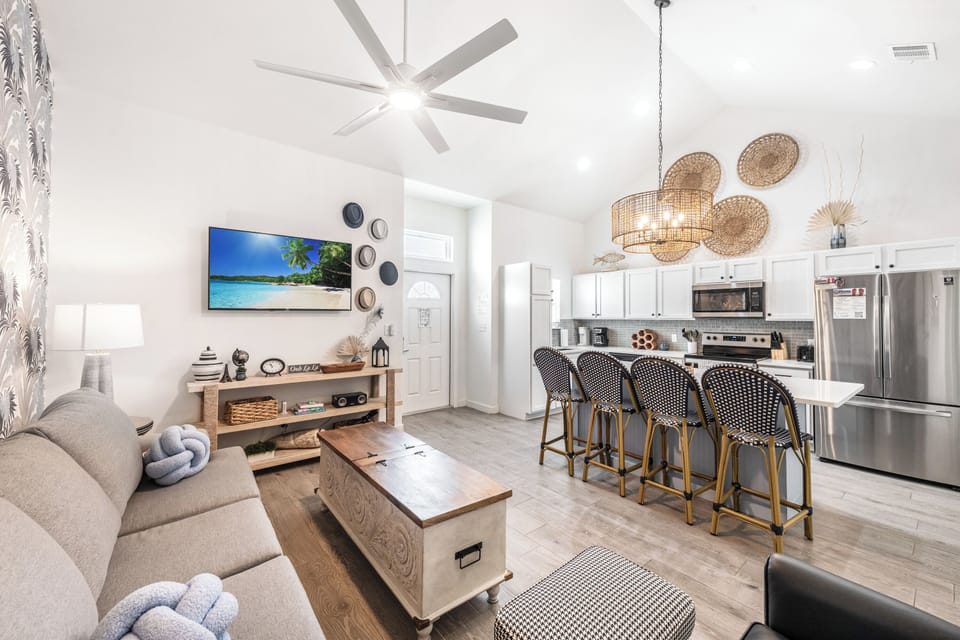 Unwind in your stylish open-concept retreat with cozy coastal vibes and modern amenities for the perfect getaway.