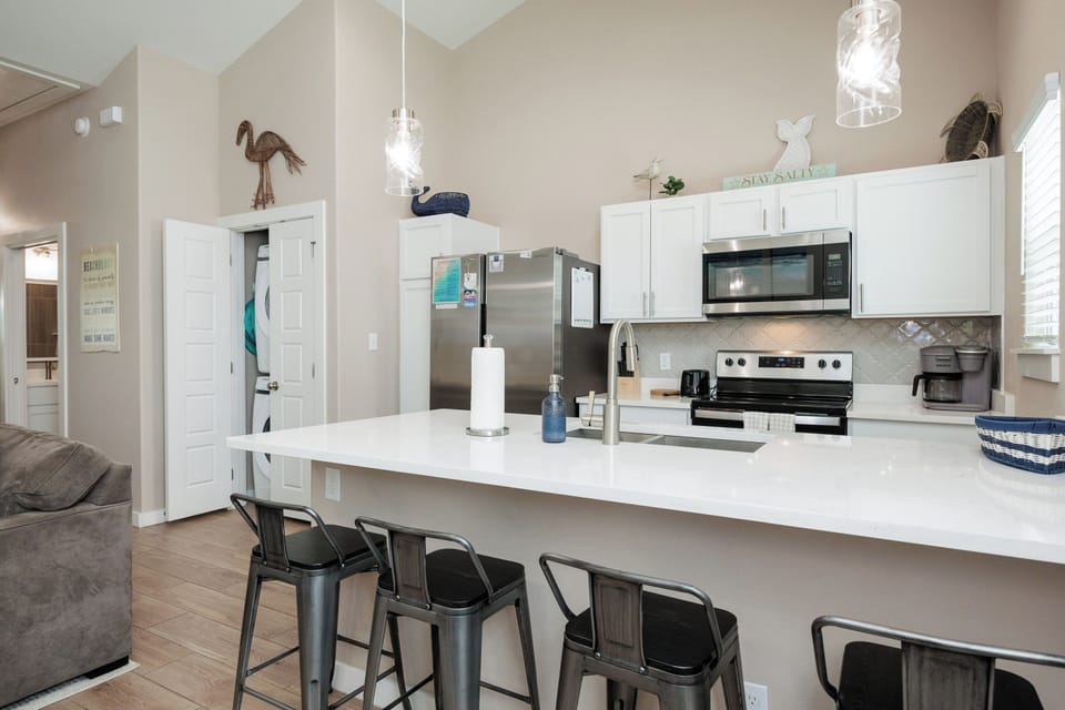 Your sleek kitchen island becomes the heart of your stay, perfect for morning coffee or casual meals with loved ones.