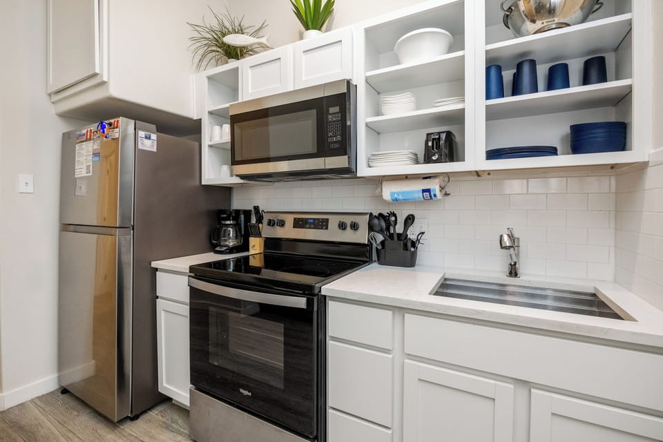 Your fully equipped kitchen awaits with modern appliances, ample counter space, and everything needed to create memorable meals during your stay.