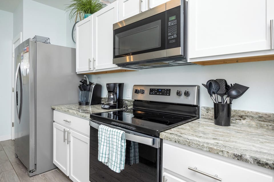 Your fully equipped kitchen makes preparing meals a breeze with granite counters, stainless appliances, and all the cookware you need.