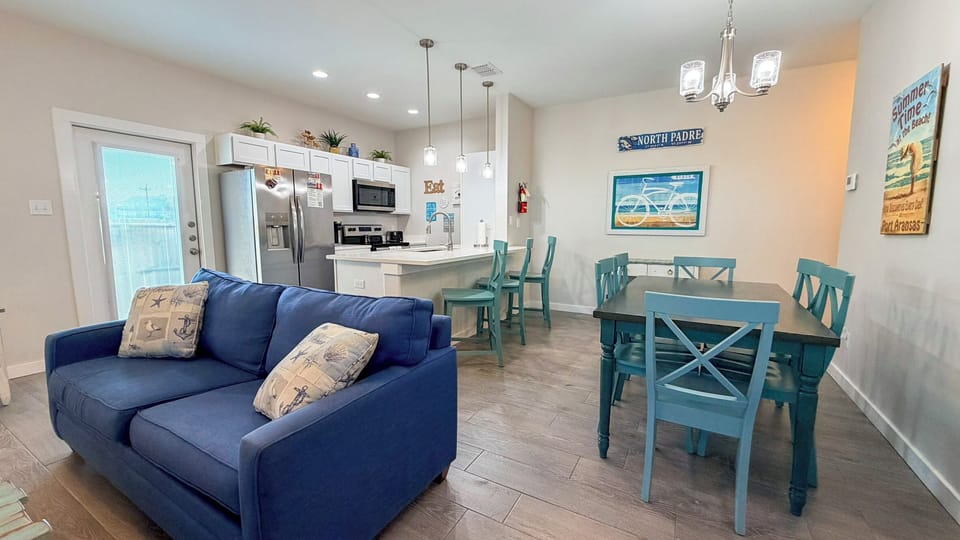 Relax in your coastal-themed living space where beach vibes meet modern comfort, complete with a full kitchen for your culinary adventures.