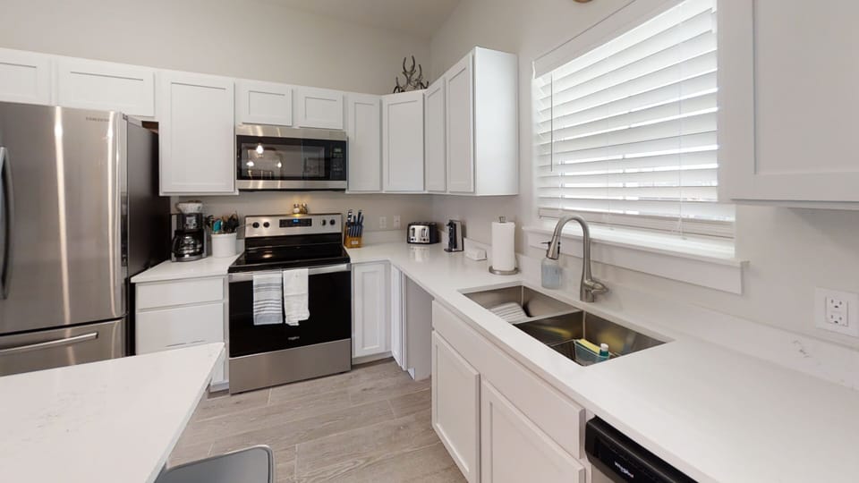 Your bright, fully equipped kitchen features stainless steel appliances and everything you need to prepare delicious meals during your stay.
