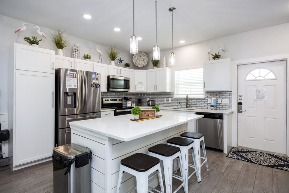 Cook gourmet meals in your stylish kitchen featuring stainless steel appliances, granite countertops, and a spacious island perfect for gathering.