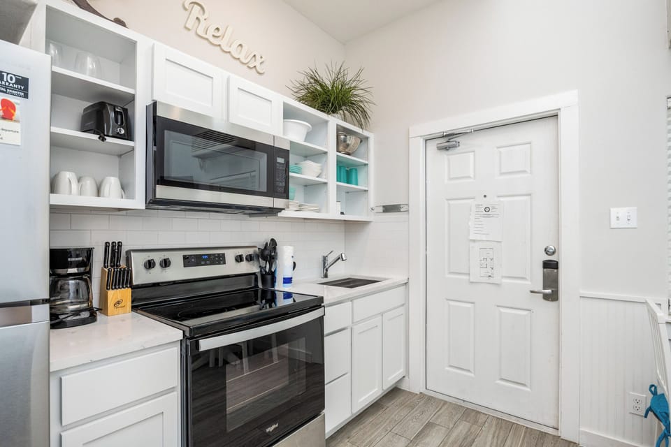Your fully equipped kitchen invites culinary adventures with modern appliances, ample storage, and everything needed for memorable meals.