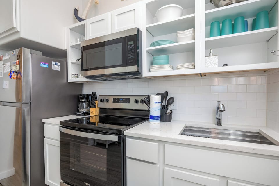 Your bright, fully-equipped kitchen makes meal prep a breeze with modern appliances and plenty of storage space.