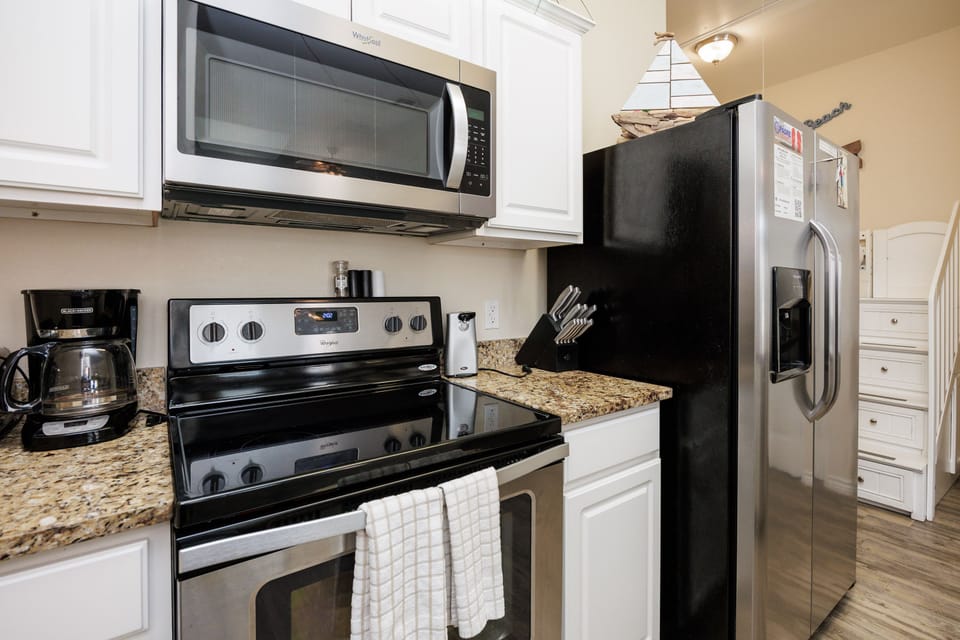 Your fully-equipped kitchen awaits with granite countertops, stainless steel appliances, and all the essentials for cooking memorable meals during your stay.