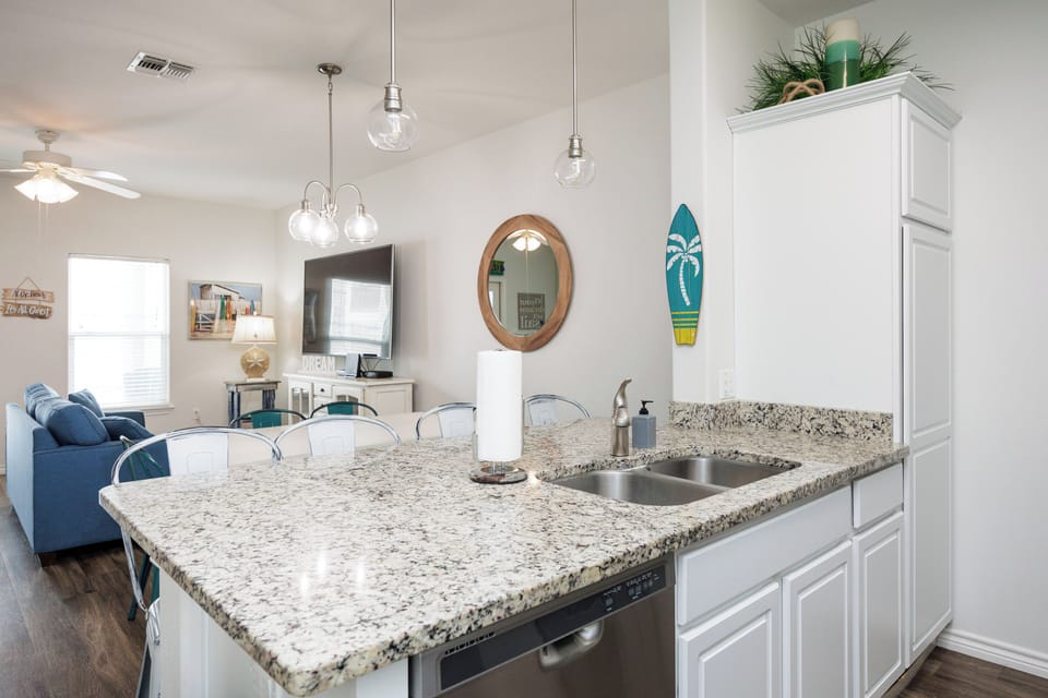 Your granite kitchen island opens to the living area, creating the perfect space for cooking and socializing.