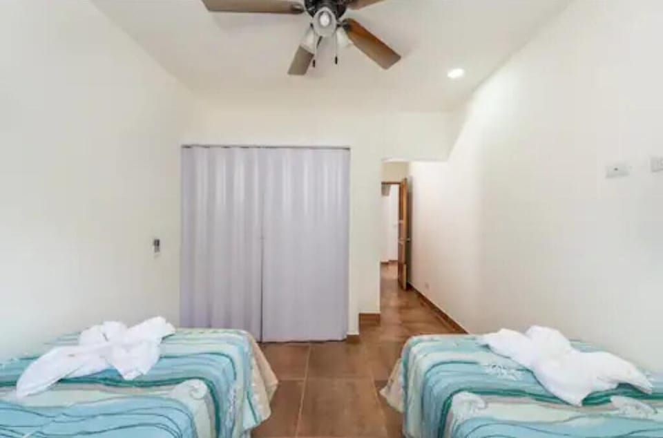 Bedroom 3 with  2 twin size beds and in suit full bathroom.