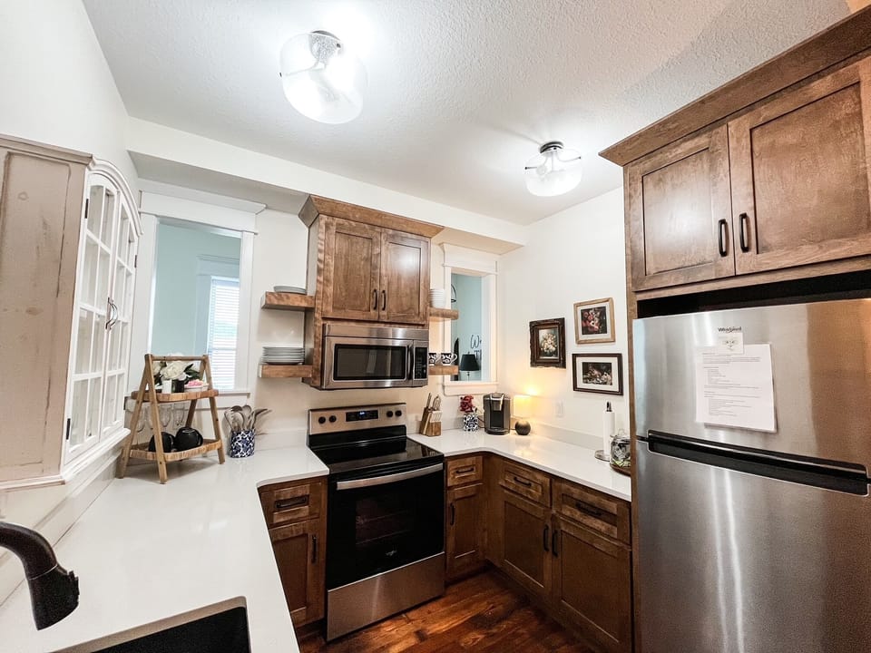 Full kitchen including fridge, stove, microwave, 2 coffee makers, glassware etc.