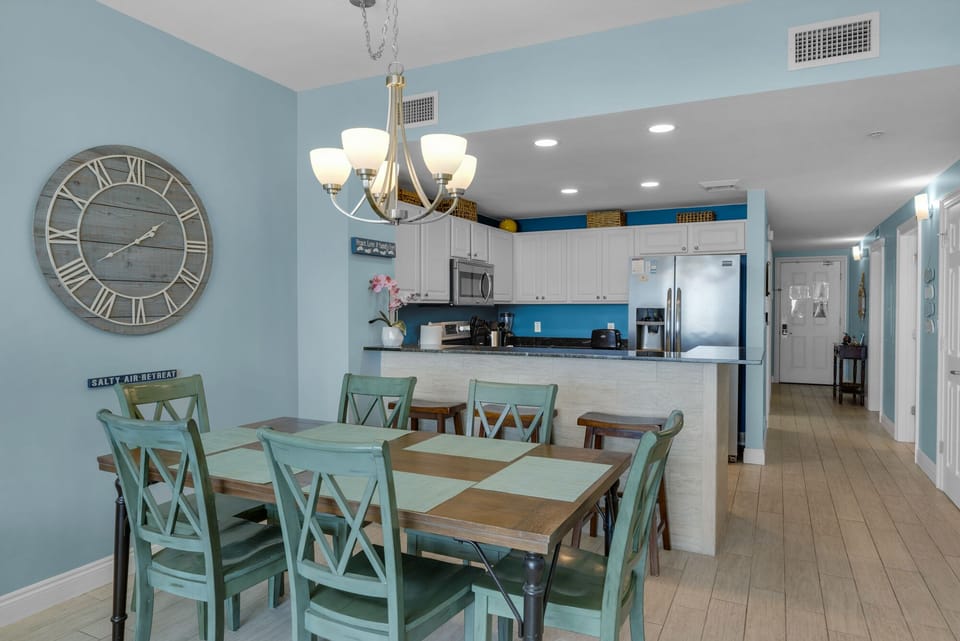 Dining Room - A bright, stylish dining area for six, ideal for enjoying fresh meals and good conversation with the beach as your dining companion.
