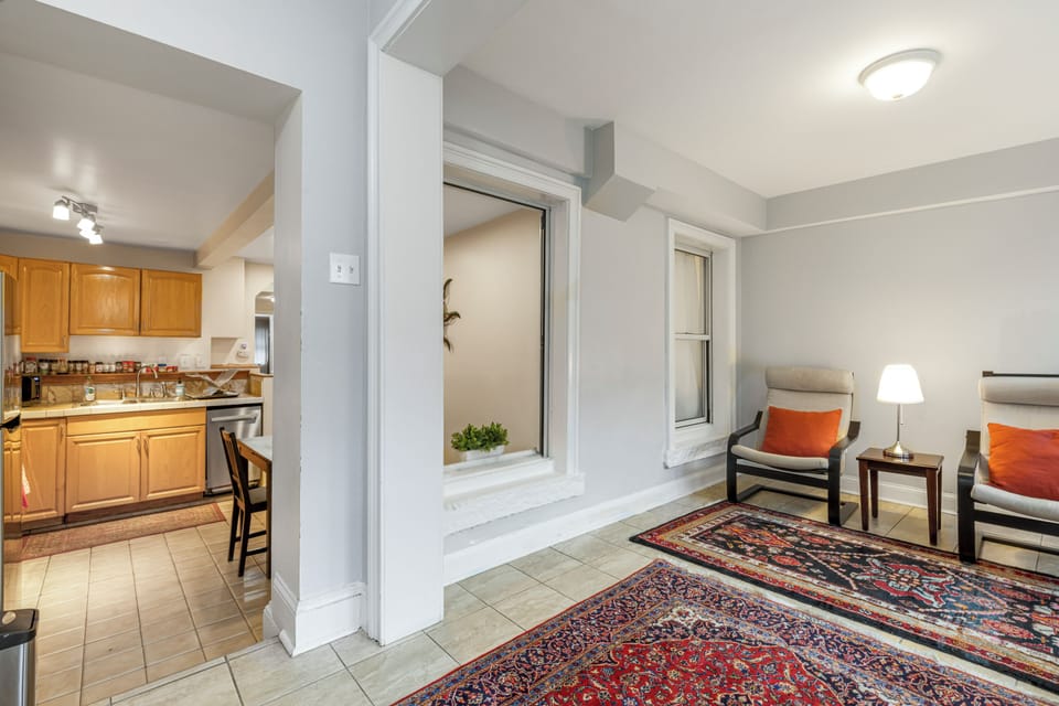 Kitchen opens to the sunroom for socializing with loved ones