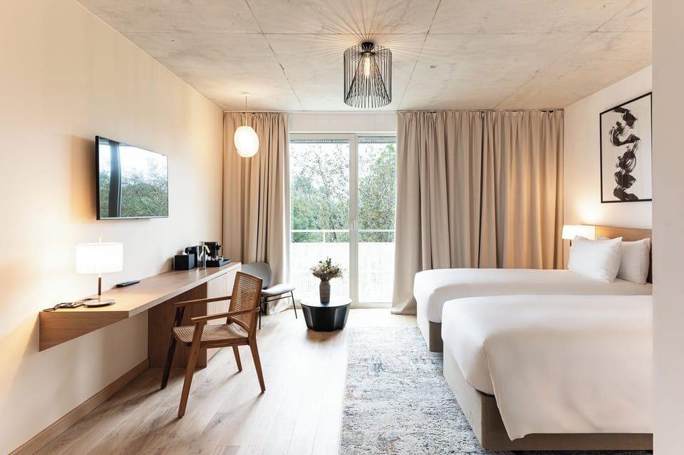 Premium bedding, down comforters, pillowtop beds, minibar